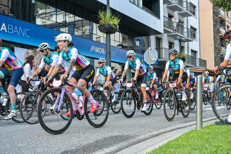 Cyclists racing on city street during event.